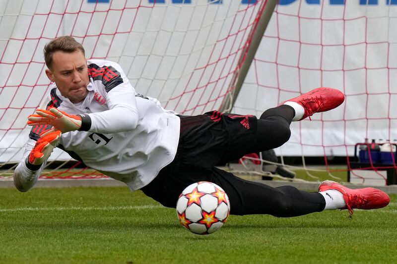 Bayern Munich goalkeeper Manuel Neuer makes a save during a training session in Munich, Germany, Tuesday, October 19, 2021. Bayern face Portuguese team Benfica in Lisbon for a Champions League Group E match on Wednesday. AP Photo