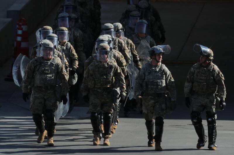 U.S. Military troops return from a test deployment with U.S. Customs and Border Protection agents after conducting a large-scale operational readiness exercise at the San Ysidro port of entry with Mexico in San Diego, California, U.S., January 10, 2019.      REUTERS/Mike Blake