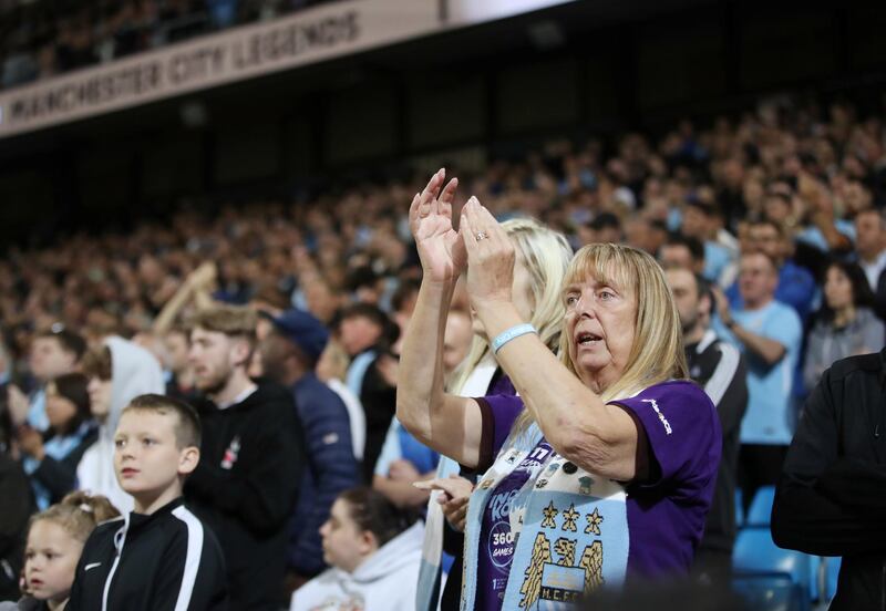 Manchester City fans applaud. Reuters