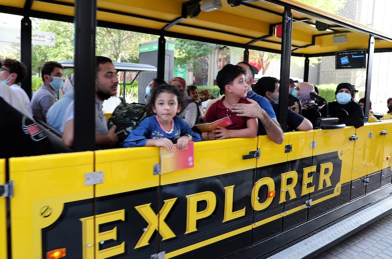 Visitors enjoy a ride on an explorer train at the Expo 2020 site in Dubai. Pawan Singh / The National