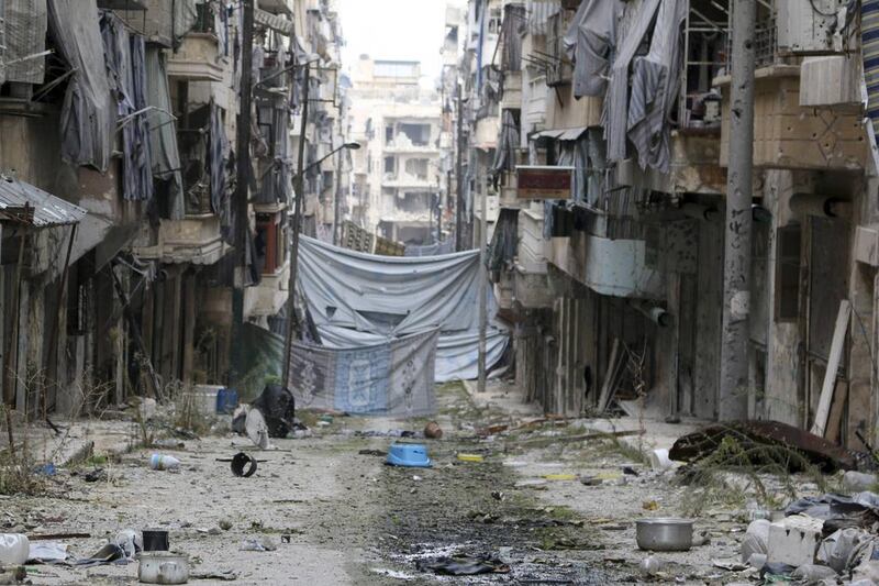 A cloth hanging provides cover from snipers in Aleppo on December 6. Mahmoud Hebbo / Reuters