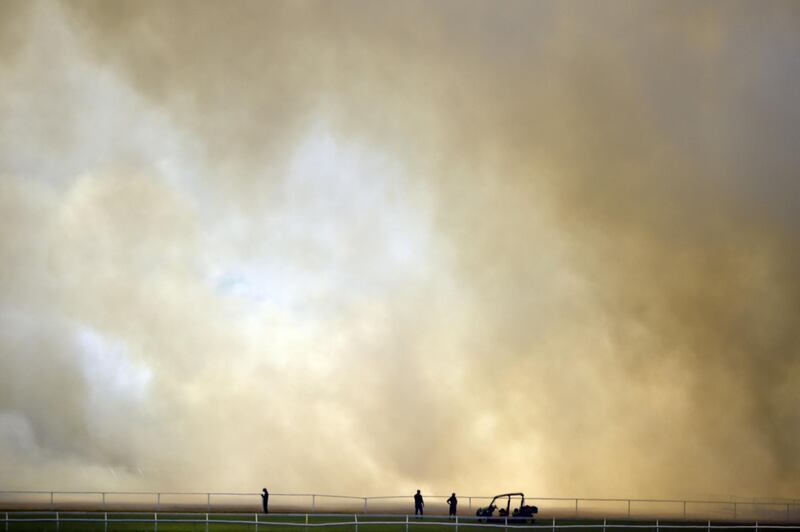 A bushfire burns outside the Perth Cricket Stadium in Perth. AFP