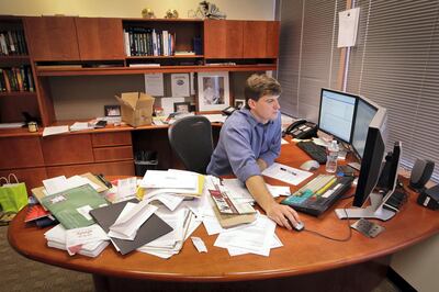 Michael Burry, former head of Scion Capital Group LLC, works in his office in Cupertino, California, U.S., on Monday, Sept. 6, 2010. Burry, the former hedge-fund manager who predicted the housing market's plunge, said he is investing in farmable land, small technology companies and gold as he hunts original ideas and braces for a weaker dollar. Photographer: Tony Avelar/Bloomberg *** Local Caption *** Michael Burry