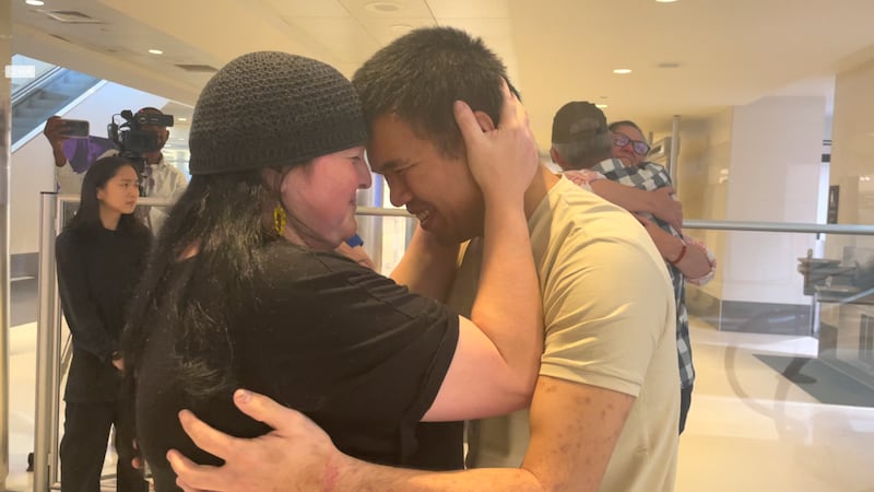 Andy Huynh, left, and Alex Drueke, far right, are seen hugging their loved ones after arriving at Birmingham-Shuttlesworth International Airport in Birmingham, Ala. , Saturday, Sept.  24, 2022.  The U. S.  military veterans disappeared three months ago while fighting Russia with Ukrainian forces.  They were released earlier this week by Russian-backed separatists as part of a prisoner exchange.  (AP Photo / Kim Chandler)