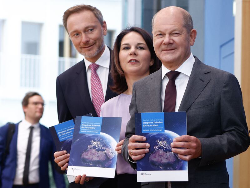 German Chancellor Olaf Scholz, right, and senior cabinet ministers present the country's first national security report in Berlin. AFP