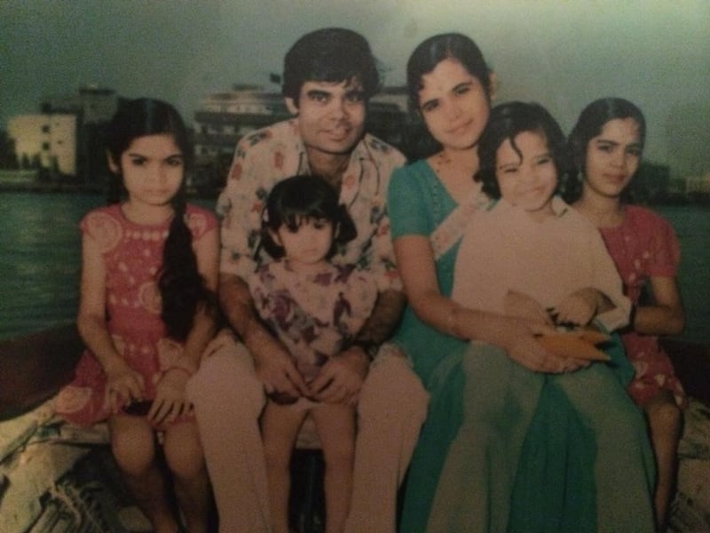 The Gajria family in the late 1970s in an abra with the Dubai Creek in the background. Jaishri Gajria and her late husband Suresh Gajria (centre) with their children Rita (from left to right), Meena, Hemant and Heena. Courtesy Gajria family