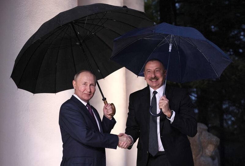 Russian President Vladimir Putin welcomes Azerbaijan President Ilham Aliyev for talks before a meeting between the Russian president and the leaders of Armenia and Azerbaijan in the Black Sea resort city of Sochi, Russia. AFP