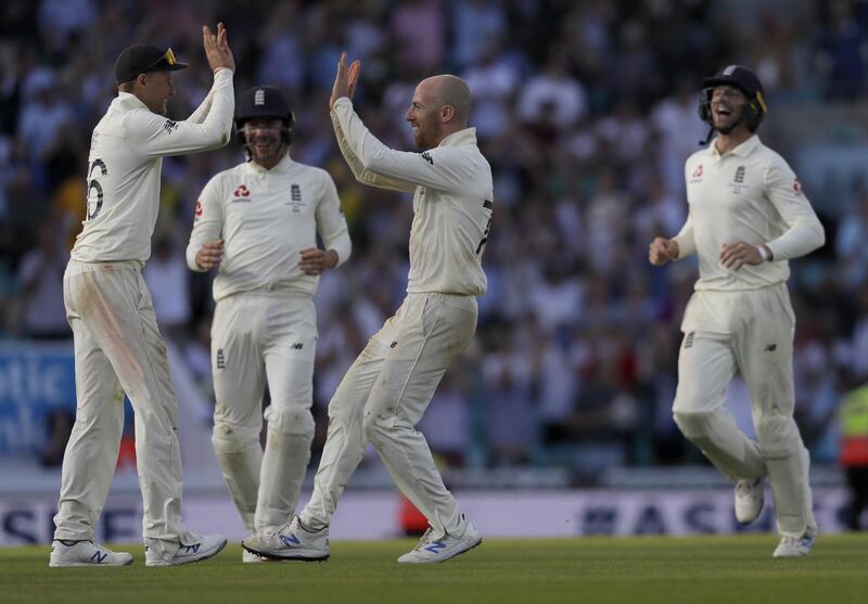 England captain Joe Root, left, celebrates with teammates after winning the fifth Ashes Test against Australia at The Oval. AP