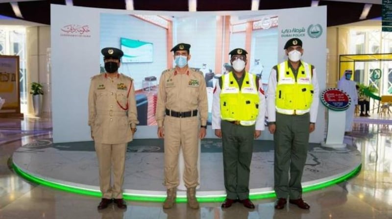 Dubai Police chief Lt Gen Abdullah Al Marri, along with a senior officer from Naif police station, honour patrol officers Corporal Abdullah Al Hosani and Abdullah Noor Al Din for their bravery. Courtesy: Dubai Police   