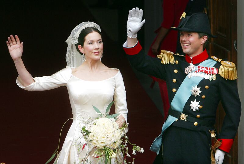 Crown Prince Frederik and his new wife Crown Princess Mary wave to the crowd following their wedding ceremony in Copenhagen in 2004. AP