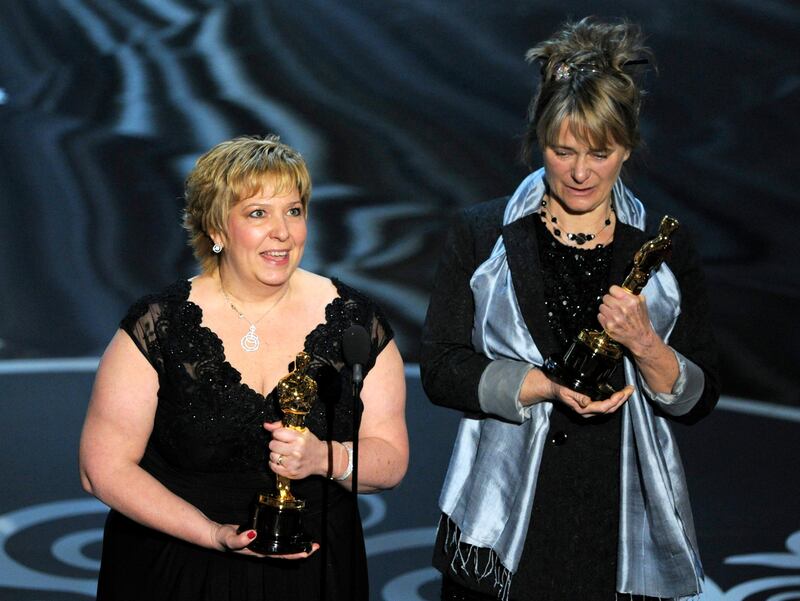 Lisa Westcott, left, and Julie Dartnell accept the award for best makeup and hairstyling for "Les Miserables" during the Oscars at the Dolby Theatre on Sunday Feb. 24, 2013, in Los Angeles.  (Photo by Chris Pizzello/Invision/AP) *** Local Caption ***  85th Academy Awards - Show.JPEG-0f823.jpg