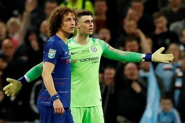 Chelsea goalkeeper Kepa Arrizabalaga, right, refuses to be substituted during Sunday's League Cup final against Manchester City at Wembley. Reuters