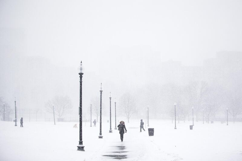 Pedestrians walk through the Boston Common during a snow storm in Boston, Massachusetts, U.S., on Thursday, Jan. 4, 2018. A fast-moving winter storm, growing stronger by the hour, has grounded 3,000 flights, delayed rail travelers in the busy Northeast Corridor and closed schools in New York and Boston. Photographer: Adam Glanzman/Bloomberg