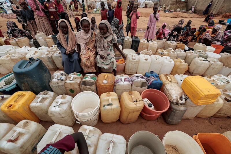 Girls who fled the conflict in Geneina, in Sudan's Darfur region, queue up for water in Adre, Chad. Reuters