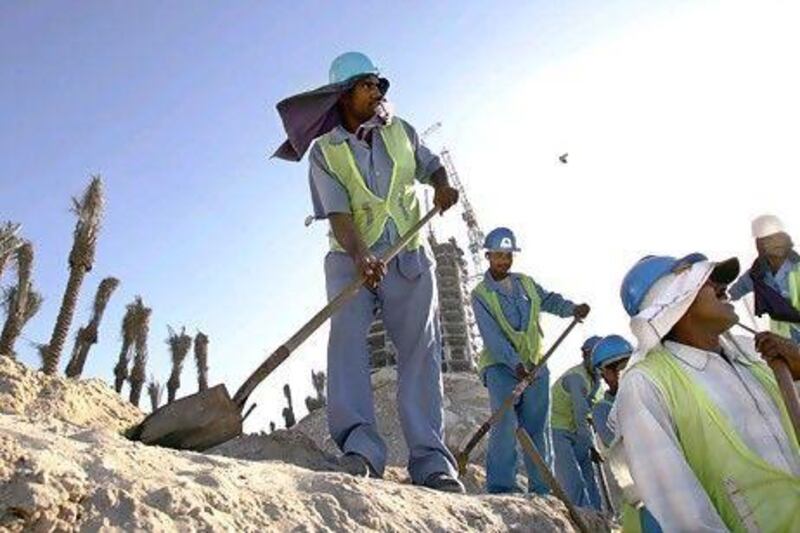 Data published yesterday by Statistics Centre-Abu Dhabi (Scad) found the average hourly wages of construction workers in the emirate rose 4.9 per cent from the start of June to last month. Philip Cheung / The National