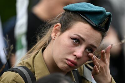 A woman at the funeral in Rishon Lezion, Israel, for Israeli Sgt Simon Shlomov, who was killed in the southern Gaza Strip. Reuters 