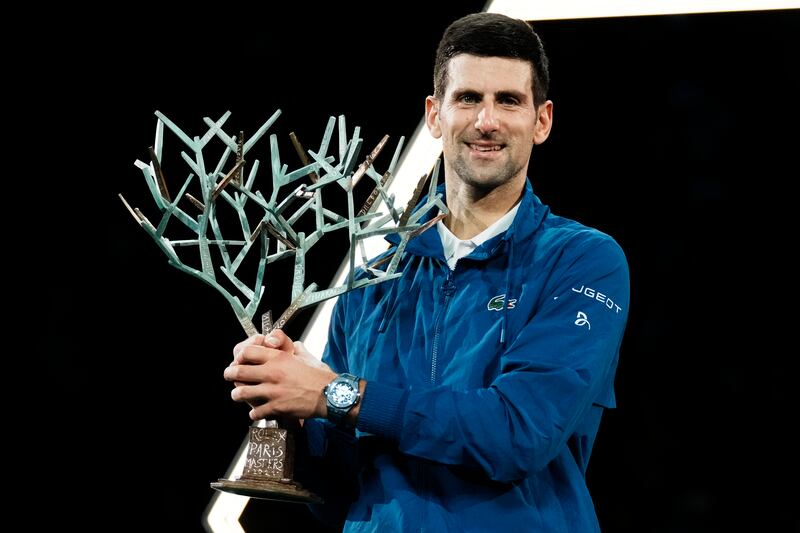 Serbia's Novak Djokovic holds his trophy after defeating Russia's Daniil Medvedev in the final match of the Paris Masters tennis tournament at the Accor Arena in Paris, Sunday, Nov. 7, 2021.  Djokovic won 4-6, 6-3, 6-3.  (AP Photo / Thibault Camus)