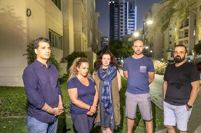 DUBAI, UNITED ARAB EMIRATES. 07 MAY 2019. Residents of the Greens in Dubai that are having restless nights due to a newly erected buildngs overpoweringly strong strobe warning lights illuminating the are at night. LtoR: Shahid Mahmood Alarta 4 building, Maryam Zandi,  Al Ghozlan 1 building, Melanie Hunt, Links West building, Steven Reilly,  Al Ghozlan 3 building and Ekin Bingol who lives in the Golf Tower 2. (Photo: Antonie Robertson/The National) Journalist: Patrick Ryan. Section: National.