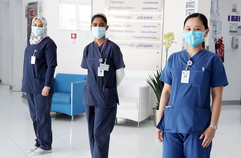 ABU DHABI, UNITED ARAB EMIRATES , May 11 – 2020 :- Left to Right-  Mervat Aslan Mhgoub Mohamed from Egypt , Sowmya Kotian from India and Shane Simeon Galang from Philippines working as a nurse at the Bareen International Hospital in Mohammed bin Zayed City in Abu Dhabi. (Pawan Singh / The National) For News. Story by Nick Webster 