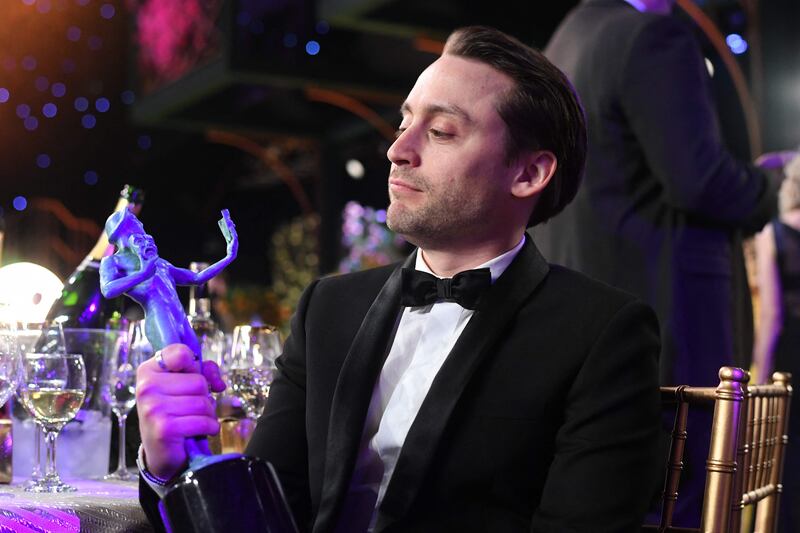 Kieran Culkin with his award for Outstanding Performance by an Ensemble in a Drama Series for 'Succession'. AFP