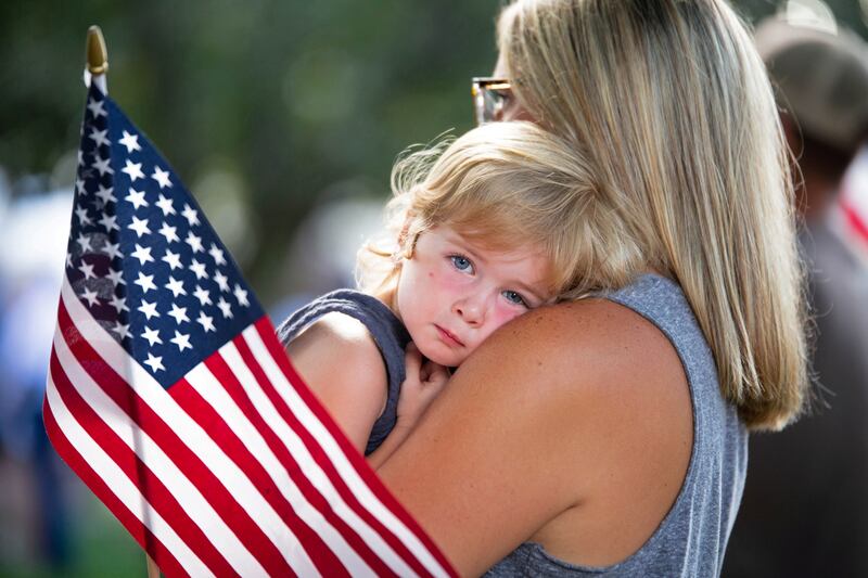 Community members gather in Berlin Heights, Ohio, for a vigil for Max Soviak, one of 13 US  service members killed in the airport suicide bombing in Kabul. Reuters