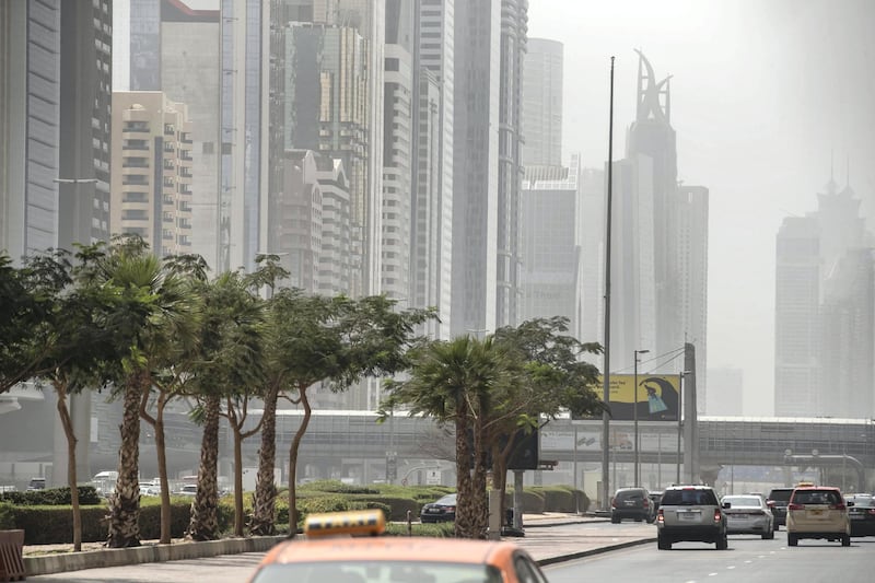 DUBAI, UNITED ARAB EMIRATES. 12 MARCH 2021. Dusty weather with wind in Dubai limits visability. (Photo: Antonie Robertson/The National) Journalist: None. Section: National.