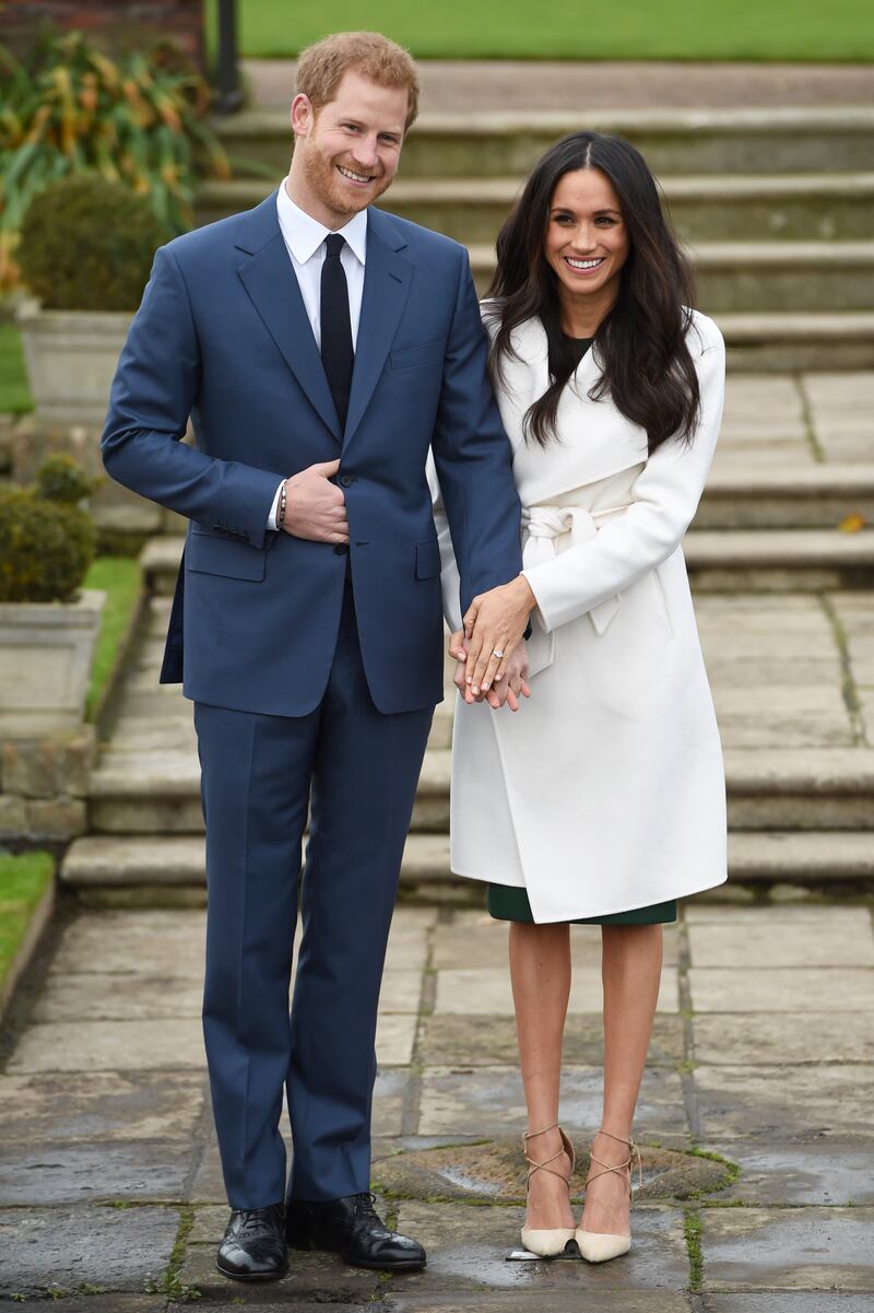 Prince Harry and Meghan during a photo call to announce their engagement at The Sunken Gardens at Kensington Palace, in November 2017. Getty Images