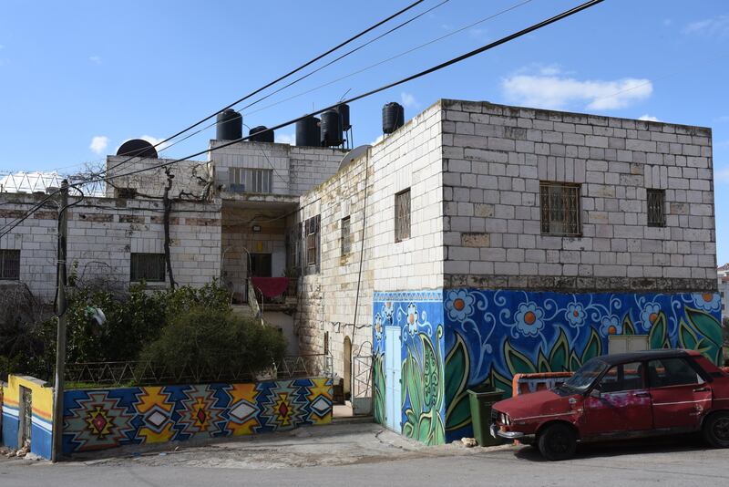 Murals on a house in the West Bank village of Beitin. 