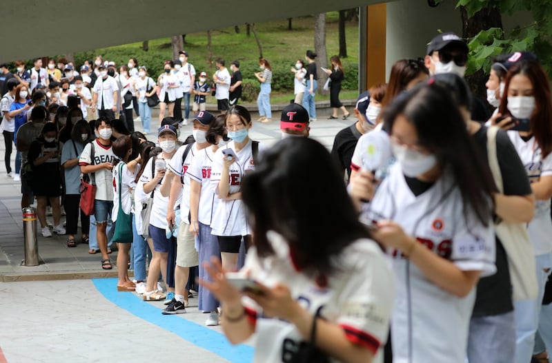 Fans line up Jamsil Baseball Stadium in Seoul, South Korea, on Sunday. EPA