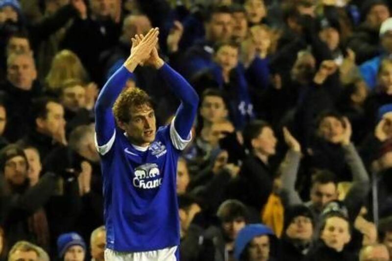 Everton's Nikica Jelavic acknowledges the fans as he leaves the field as the match-winner against Tottenham Hotspur.