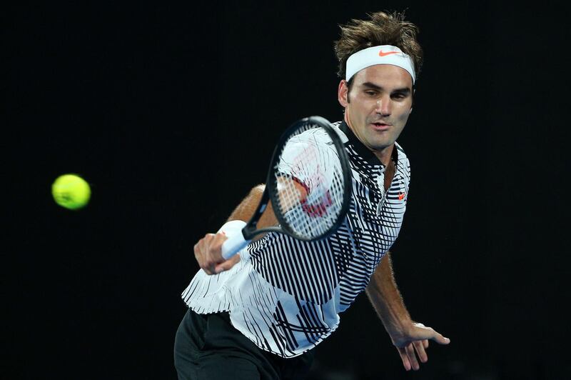 MELBOURNE, AUSTRALIA - JANUARY 29:  Roger Federer of Switzerland plays a backhand in his Men's Final match against Rafael Nadal of Spain on day 14 of the 2017 Australian Open at Melbourne Park on January 29, 2017 in Melbourne, Australia.  (Photo by Michael Dodge/Getty Images)