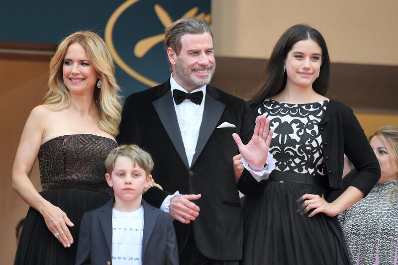 US actor John Travolta (2ndR), his wife US actress Kelly Preston (L) and their children Ella Bleu Travolta (R) and Benjamin Travolta  pose as they arrive on May 15, 2018 for the screening of the film "Solo : A Star Wars Story" at the 71st edition of the Cannes Film Festival in Cannes, southern France. (Photo by LOIC VENANCE / AFP)