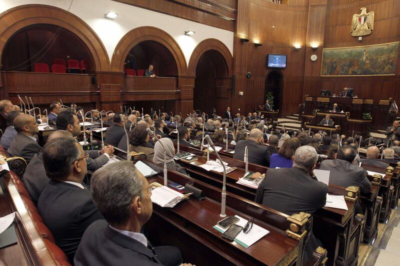 Egypt's Parliament Speaker Ali Abdel-Aal (R) chairs the House of Representatives' constitutional and legislative affairs committee, during the first session of hearings on the proposed constitutional amendments in the capital Cairo on March 20, 2019. - Egypt's parliament on February 14 submitted to the legislative commission a series of constitutional changes that would allow President Abdel Fattah al-Sisi to stay in power after his second term ends in 2022. The amendments are to be drafted into legislation and to be returned back for a final vote. (Photo by - / AFP)