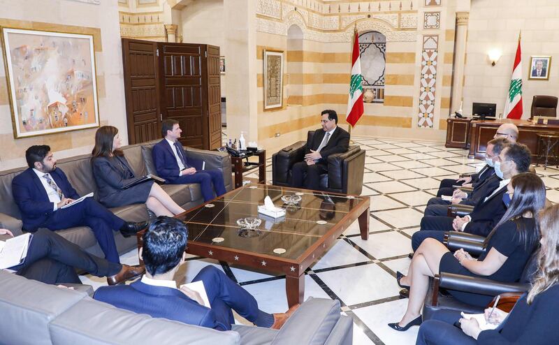 A handout picture provided by the Lebanese photo agency Dalati and Nohra shows US Undersecretary of State for Political Affairs David Hale meeting with caretaker Lebanese prime minister Hassan Diab at the government palace in the capital Beirut. AFP