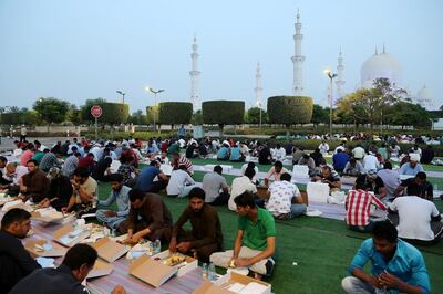 ABU DHABI,  UNITED ARAB EMIRATES , May 6 – 2019 :- People breaking their fast on the First day of Ramadan at the Sheikh Zayed Grand Mosque in Abu Dhabi. ( Pawan Singh / The National ) For News/Online/Big Picture/ Instagram