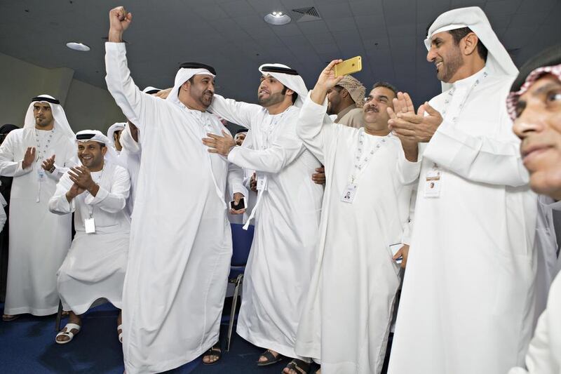 Mohammed Al Yammahi celebrates with his supporters after winning the FNC election at the Fujairah Expo Centre on Saturday. Antonie Robertson / The National 