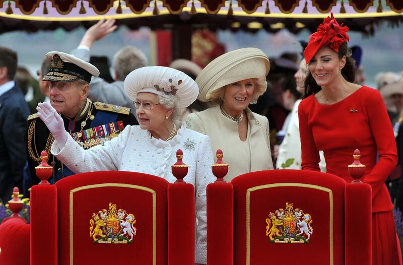Prince Philip, Queen Elizabeth, Camilla, Duchess of Cornwall, and Catherine, Duchess of Cambridge on board the 'Spirit of Chartwell' during the diamond jubilee pageant on the River Thames in June 2012.