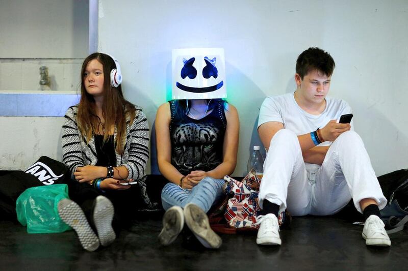 Visitors take a rest after a long day at the Gamescom fair in Cologne. Ralph Orlowski  / Reuters