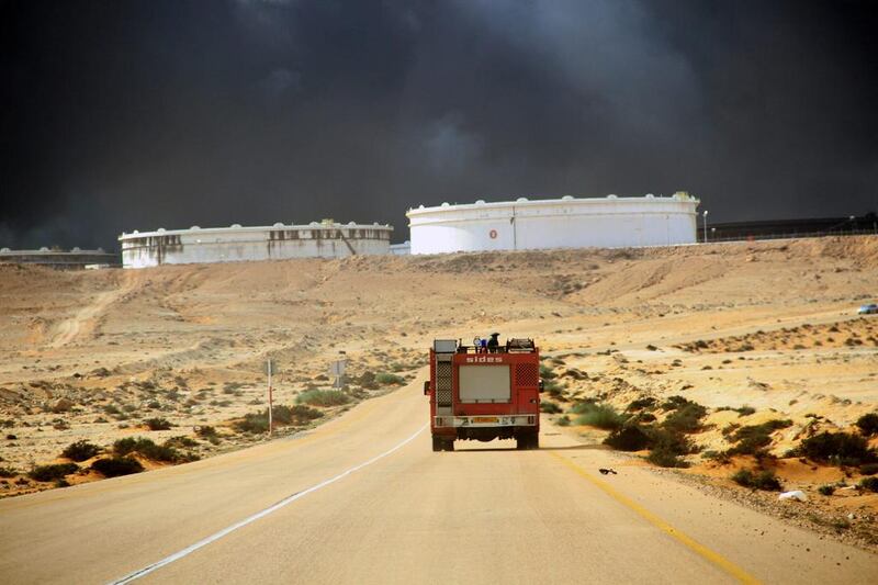 Smokes rises following a fire in an oil storage tank at the port of Ras Lanuf, Libya on January 23, 2016. Gen Khalifa Haftar seized the port on Sunday from guards loyal to a rival government. Reuters 