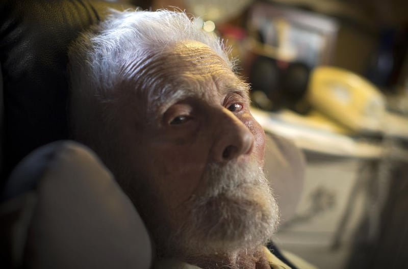 111-year-old Dr Alexander Imich the world's oldest living man poses for a photograph during an interview with Reuters at his home on New York City's upper west side, 9 May, 2014. Dr Imich, who holds a PhD in Zoology, was born in Poland on 4 February, 1903, fled Poland when the Nazis took over in 1939, survived a slave labor camp in Russia and moved to the United States in 1951 where he became an author on parapsychology. Reuters