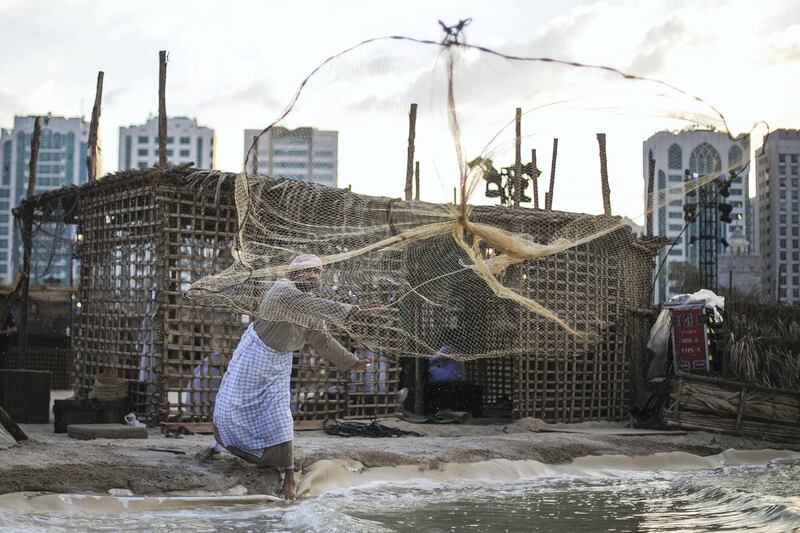 Abu Dhabi, United Arab Emirates. February 1, 2016///

Fisherman throwing a net to catch fish. Qasr Al Hosn Festival media preview. Abu Dhabi, United Arab Emirates. Mona Al Marzooqi/ The National 

ID: 72220
Reporter: Haneen Dajani 
Section: National/Arts&Life  *** Local Caption ***  160201-MM-QAHpreview-023.JPG