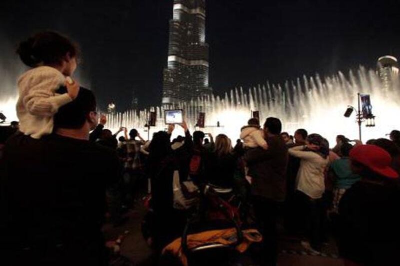 Dubai, United Arab Emirates - December 31, 2012.  Spectators waiting for the New Years fireworks spectacle around Burj Khalifa.  ( Jeffrey E Biteng / The National )