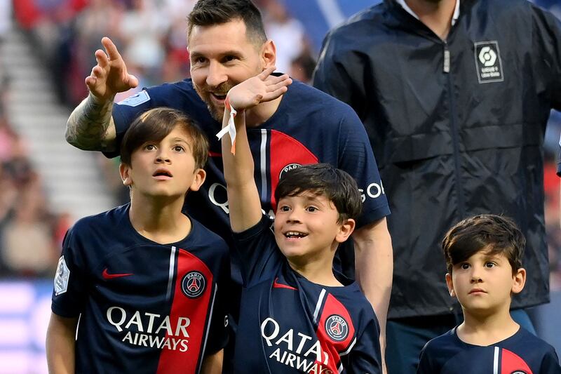 Lionel Messi attends with his children. AFP
