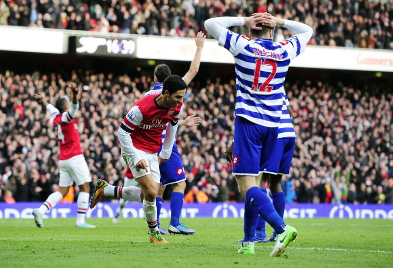 Arsenal's Spanish midfielder Mikel Arteta (2nd L) celebrates scoring the only goal of the English Premier League football match between Arsenal and Queens Park Rangers at The Emirates Stadium in north London, England on October 27, 2012. Arsenal won the game 1-0. AFP PHOTO/GLYN KIRK

RESTRICTED TO EDITORIAL USE. No use with unauthorized audio, video, data, fixture lists, club/league logos or “live” services. Online in-match use limited to 45 images, no video emulation. No use in betting, games or single club/league/player publications.
 *** Local Caption ***  765796-01-08.jpg