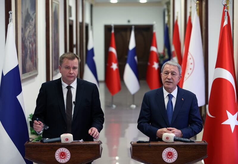 Turkish Defence Minister Hulusi Akar, right, and his Finnish counterpart Antti Kaikkonen speak to the media after talks in Ankara, Turkey. AP