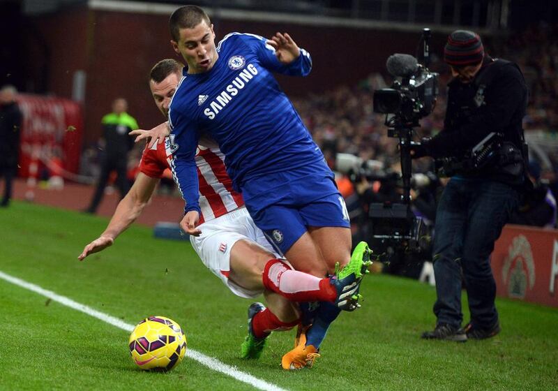 Stoke City’s Phil Bardsley (back) challenges Chelsea’s Eden Hazard during the English Premier League soccer match between Stoke City and Chelsea at the Britannia Stadium in Stoke, Britain, 22 December 2014.  EPA/NIGEL RODDIS