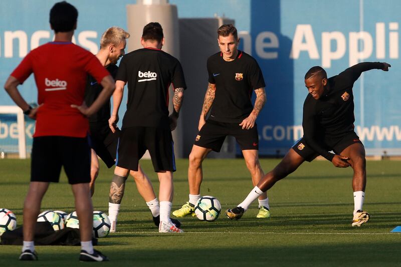 Barcelona defender Nelson Semedo, right, takes part in the training session. Pau Barrena / AFP