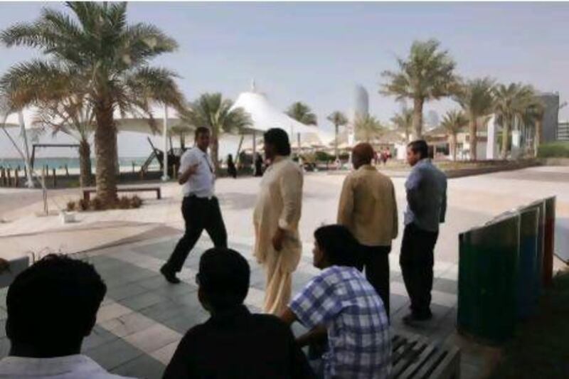 Security from Family beach on Corniche asking the construction workers to leave the place. Ravindranath K / The National