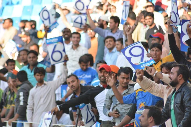 Fans wave signs at the Pakistan Super League match in Dubai on Friday. Photo Courtesy / PSL / February 5, 2016