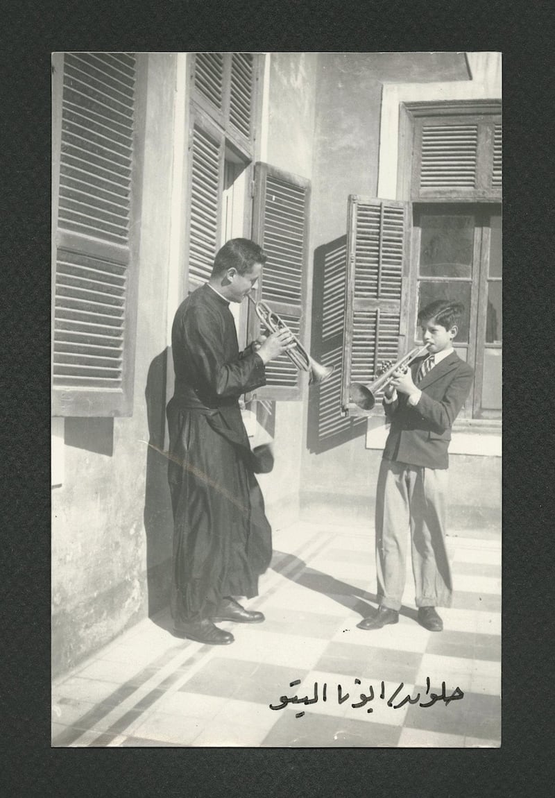Student playing the trumpet with Father Aletto, circa 1949-1950. Copyright Collège de la Sainte Famille